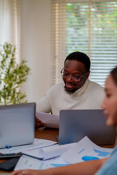 istock Collaborative business meetings often involve technology and analysis, where professionals discuss marketing strategies and AI innovations to enhance productivity and growth 2219725441