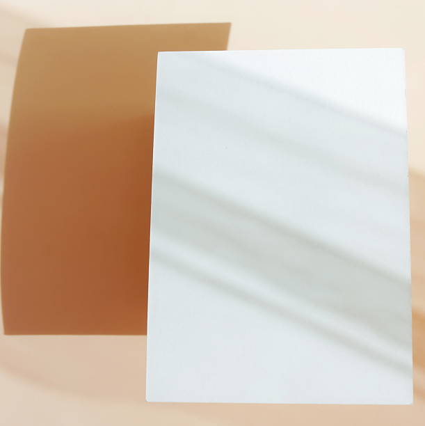 istock Card mockup empty blank paper and sunlight shadow on beige background top view . Copy space. 2219728523