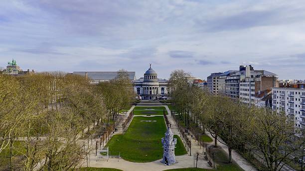 istock Aerial view of Parc du Cinquantenaire in Brussels, Belgium, with tree-lined paths and classical architecture, historic park with green lawns and monuments, urban landscape and tourism concept, Atticus 2219731839