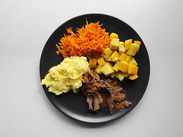 Roasted beef with mashed potatoes, stewed carrots and yellow zucchini, homemade lunch