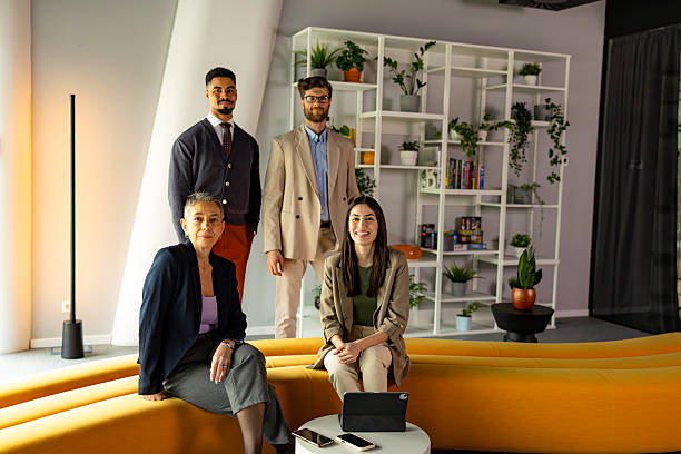 istock Business team posing in modern office with plants 2219737590