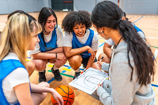 istock Female basketball coach explaining game strategy to team 2219738365