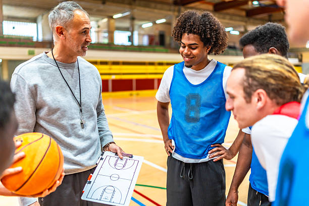 istock Basketball coach explaining game strategy to team 2219738578