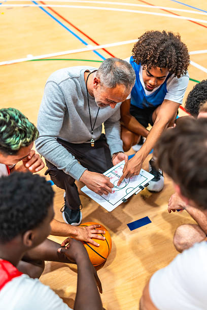 istock Basketball coach explaining game strategy to his team 2219738591