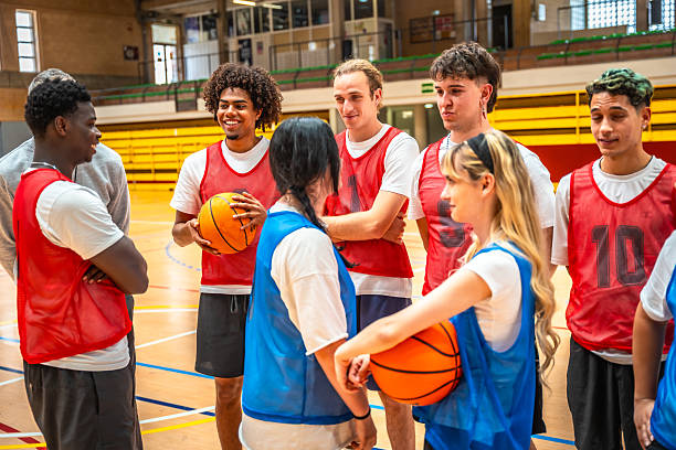 istock Basketball players discussing game strategy during training session 2219738742