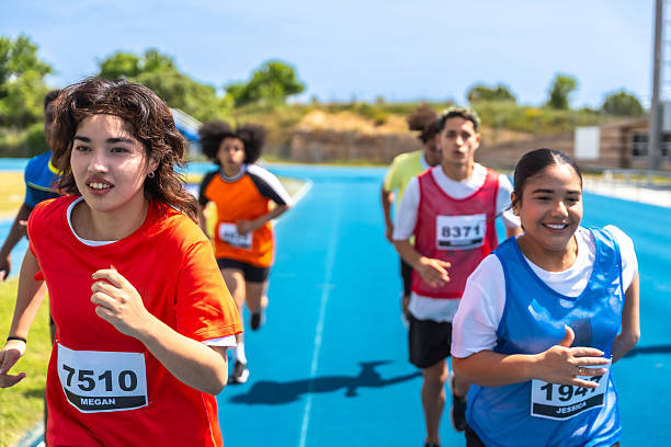 istock Teenagers running on a blue track during a competition 2219738778