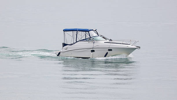 istock A small white boat is on the water 2219740782