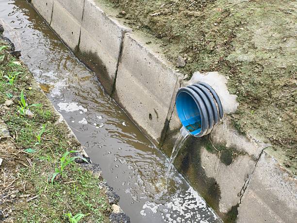 istock Sewage flows into the river. Pollution of the river 2219741519