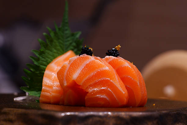 Salmon cut into pieces and garnished with caviar.