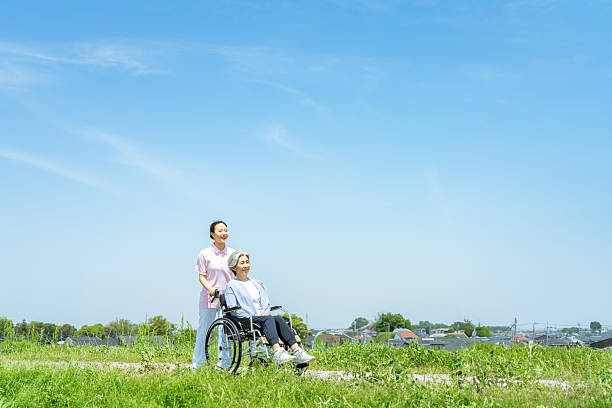 Caregiver pushing a wheelchair