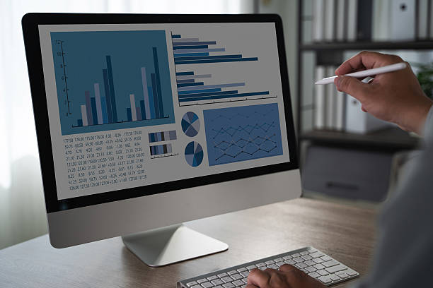 istock Online Business Coach Person analyzing data computer screen displaying various charts and graphs, with focus business or financial analysis 2219751633