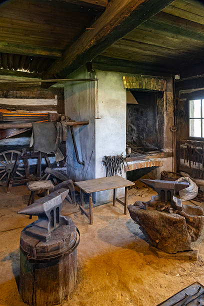 istock Traditional blacksmith workshop interior showing anvils, tools, and forge in Kourim, Czechia 2219758193