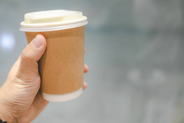 istock Hand Holding Sustainable Paper Coffee Cup. 2219758622