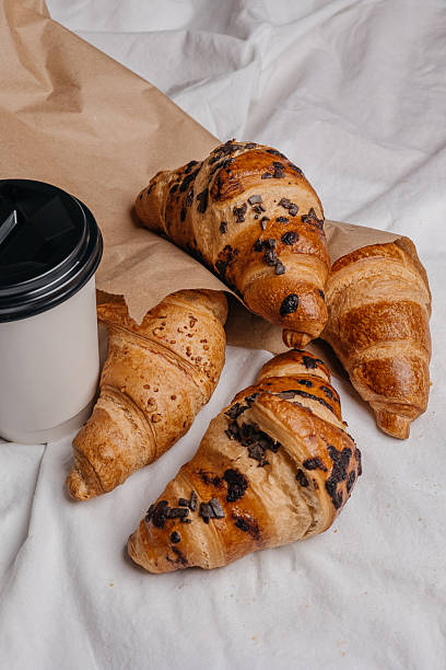 istock Fresh Croissants and Coffee To Go 2219760358