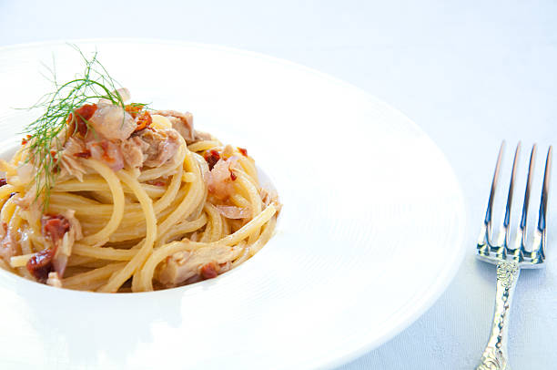 istock Spaghetti with pesto red onion and tuna 2219763922