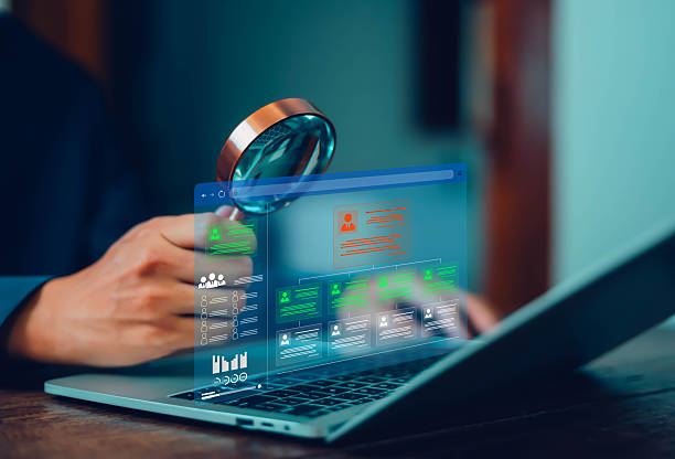 istock Businessman using magnifying glass in job search network with human resource development concept icons. Recruitment leadership, resources, policy, feedback, professional team. 2219764647