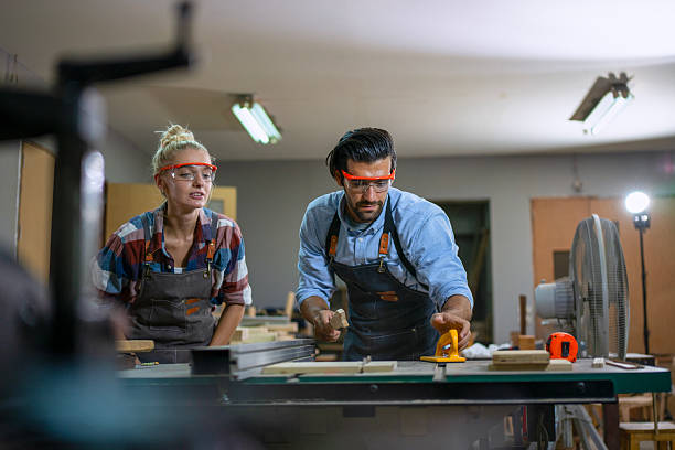 istock Carpenters are working together at workshop. 2219764719