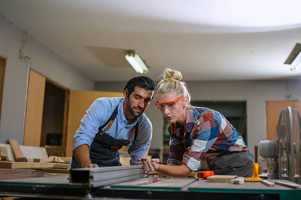 istock Carpenters are working together at workshop. 2219764779