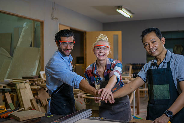 istock Carpenters are working together at workshop. 2219764783