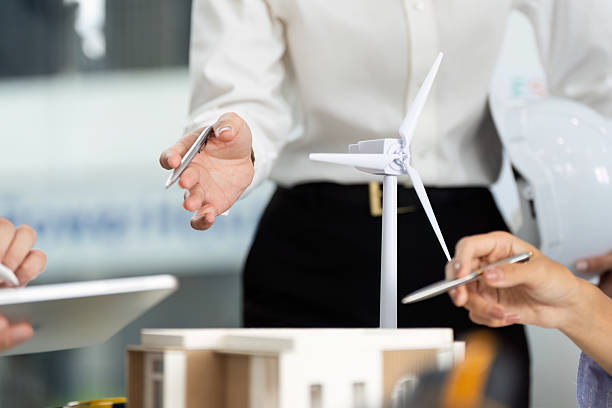 istock Collaborative Sustainable Design Discussion. Team analyzing eco-friendly model during meeting. 2219767851