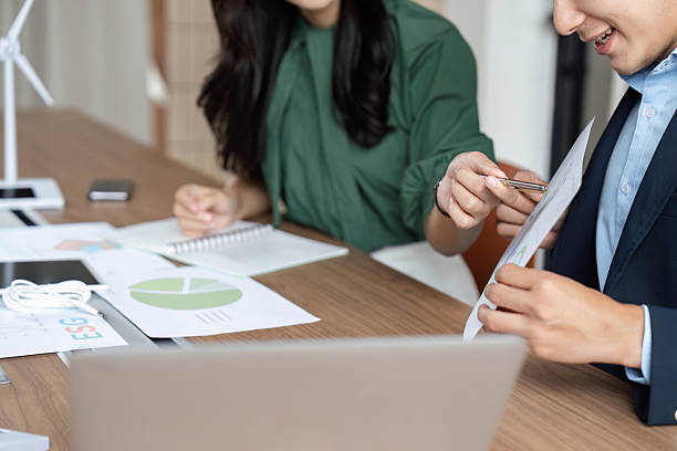 istock ESG Collaboration. Professionals reviewing data and discussing strategies for sustainability. 2219769461