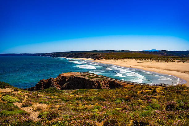 istock Empty Bordeira beach in Portugal. Beautiful Algarve coastline. View at sandy beach and cliffs 2219771189