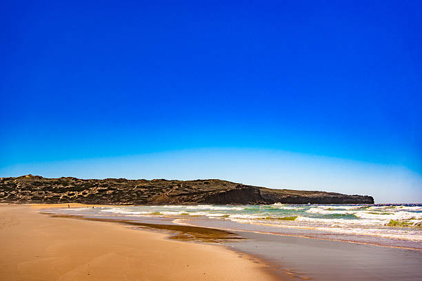 istock Empty Bordeira beach in Portugal. Beautiful Algarve coastline. View at sandy beach and cliffs 2219771231