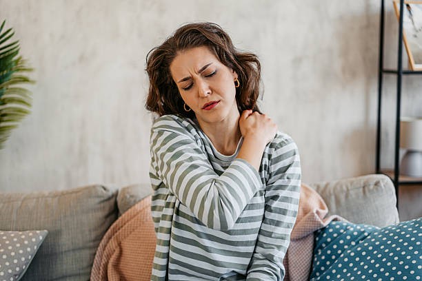 istock Young Woman Having A Neckache At Home 2219773581