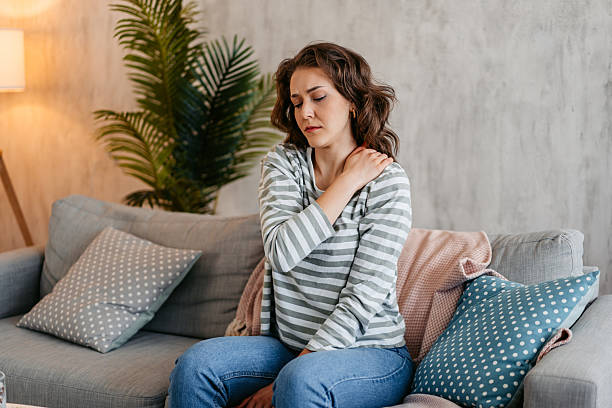 istock Young Woman Having A Neckache At Home 2219774466