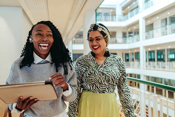 istock Female colleagues smiling together 2219774842