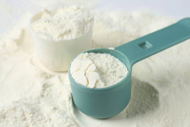 istock Pile of protein powder and scoops, closeup 2219776243