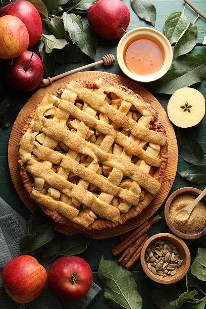 istock Tasty homemade apple pie and ingredients on table, flat lay 2219776350