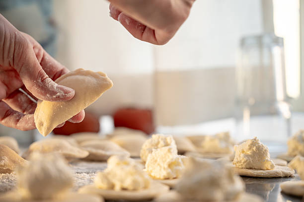 istock Forming dumplings, close-up of hands at work. 2219778681