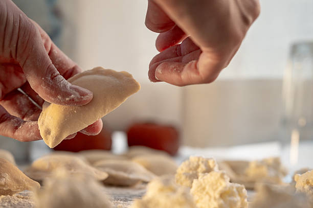 istock Forming dumplings, close-up of hands at work. 2219778691