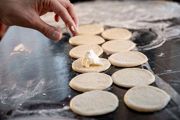 istock Forming dumplings, close-up of hands at work. 2219779229