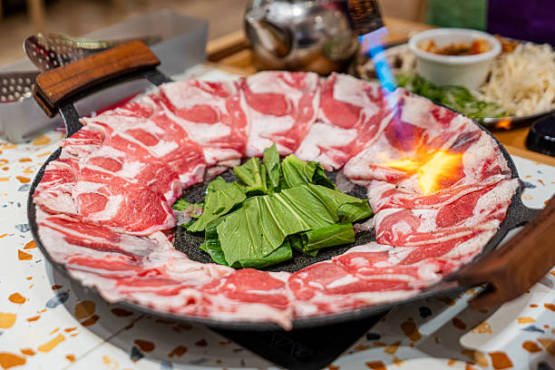 istock Korean BBQ with Sliced Beef and Vegetables Grilled with Torch on Hot Plate 2219784241