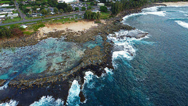 istock Rocky shoreline and clear reef waters along a Hawaiian coast. 2219784242