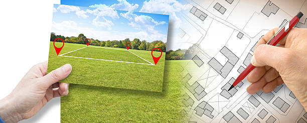 Land plot management - real estate concept with a vacant land on a green field available for building construction and housing subdivision in a residential area for sale, rent, buy or investment