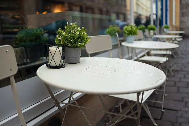 istock Outdoor Cafe Seating with Plants and Lantern 2219788358
