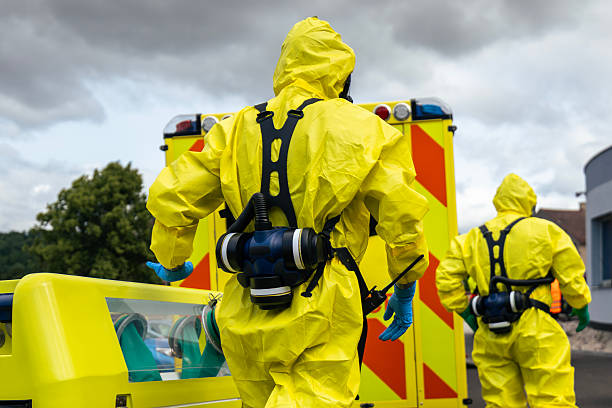 istock Biohazard team of emergency medical service in protective suits 2219789633