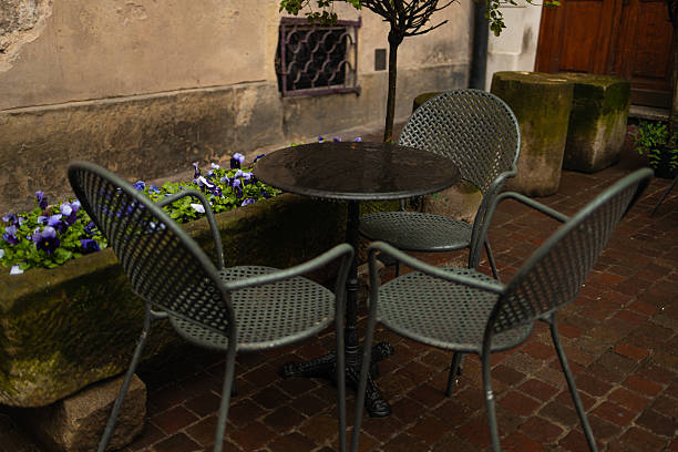 istock Empty Outdoor Cafe Seating on Rainy Day 2219791220