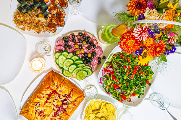 Appetizing Cherry and Apple Pie With Fruit Jam Placed Along With Vegetable Salad and Meat Plate, Sushi Assortment On White Plate.