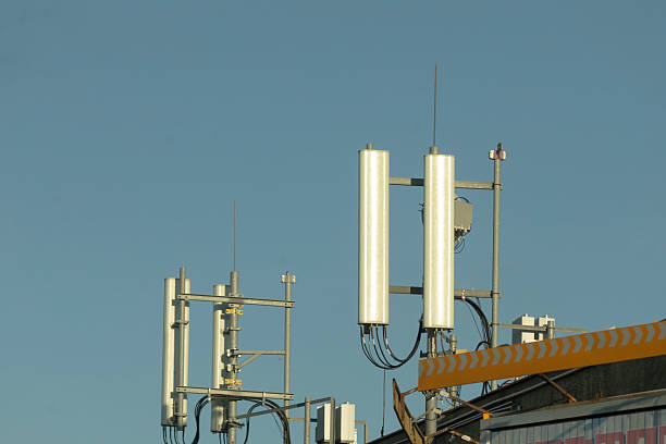 istock Telecommunications antennas installed atop a rooftop under a clear sky 2219794964