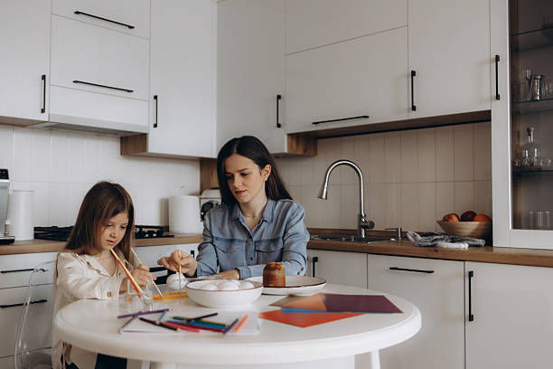 istock Mother and Daughter Bonding During Arts Activity in a Family Kitchen Setting 2219798702