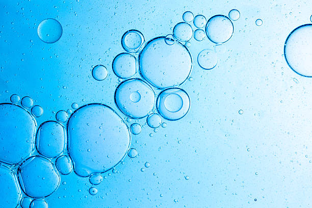 istock Close-up blue science experiment bubble texture,Bubbles in clear liquid, water or gel texture, oil drop, beauty collagen serum, hyaluronic essence skin care smear, aqua purity, abstract background. 2219801173