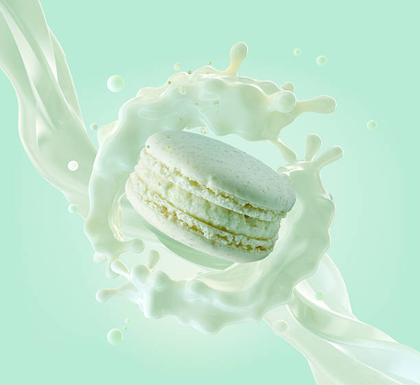 istock 3D render of macaron, cream splash, mint green background. 2219801751