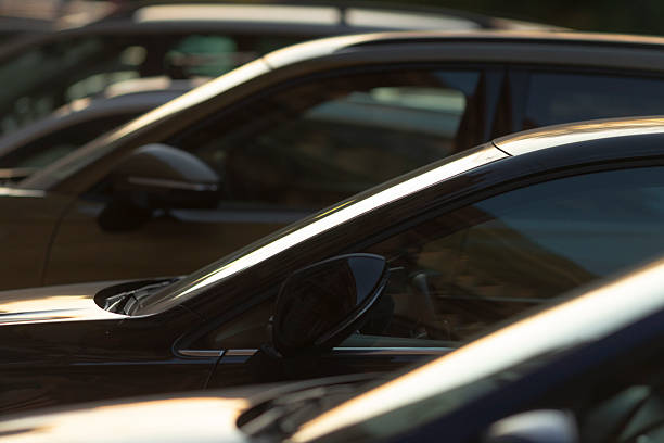 istock Parked automobiles observed from a side view within an urban environment 2219802572