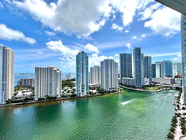 istock Speedboat navigating the Miami River surrounded by Brickell's skyscrapers in Florida 2219805371