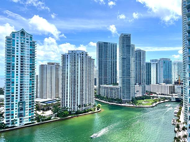 istock Speedboat navigating the Miami River surrounded by Brickell's skyscrapers in Florida 2219805394