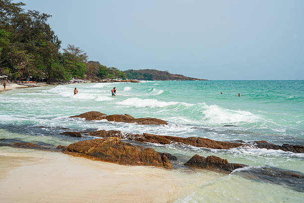 istock People Enjoying the Clear Water on a White Sand Beach 2219806424